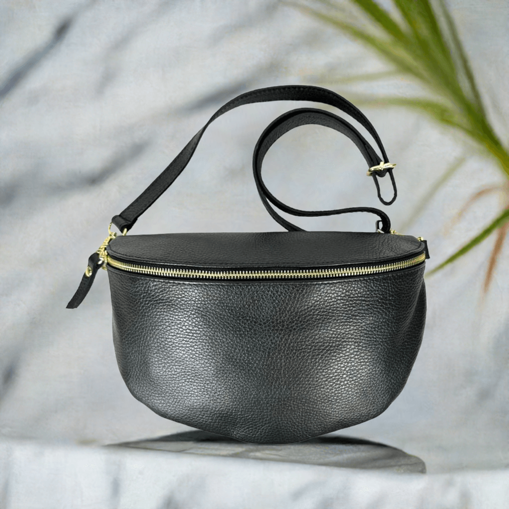 Elegant Italian leather crossbody bum bag with adjustable strap and secure zip closure.